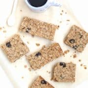 Overhead shot of tahini cherry granola bars and a cup of coffee
