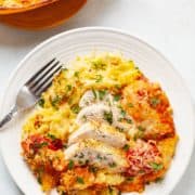 plate of sliced chicken breast and roasted spaghetti squash with tomato sauce, mozzarella, panko and parmesan