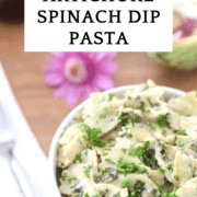 a bowl of artichoke spinach bowtie pasta
