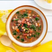 Bowl of 15 bean soup with carrots and spinach