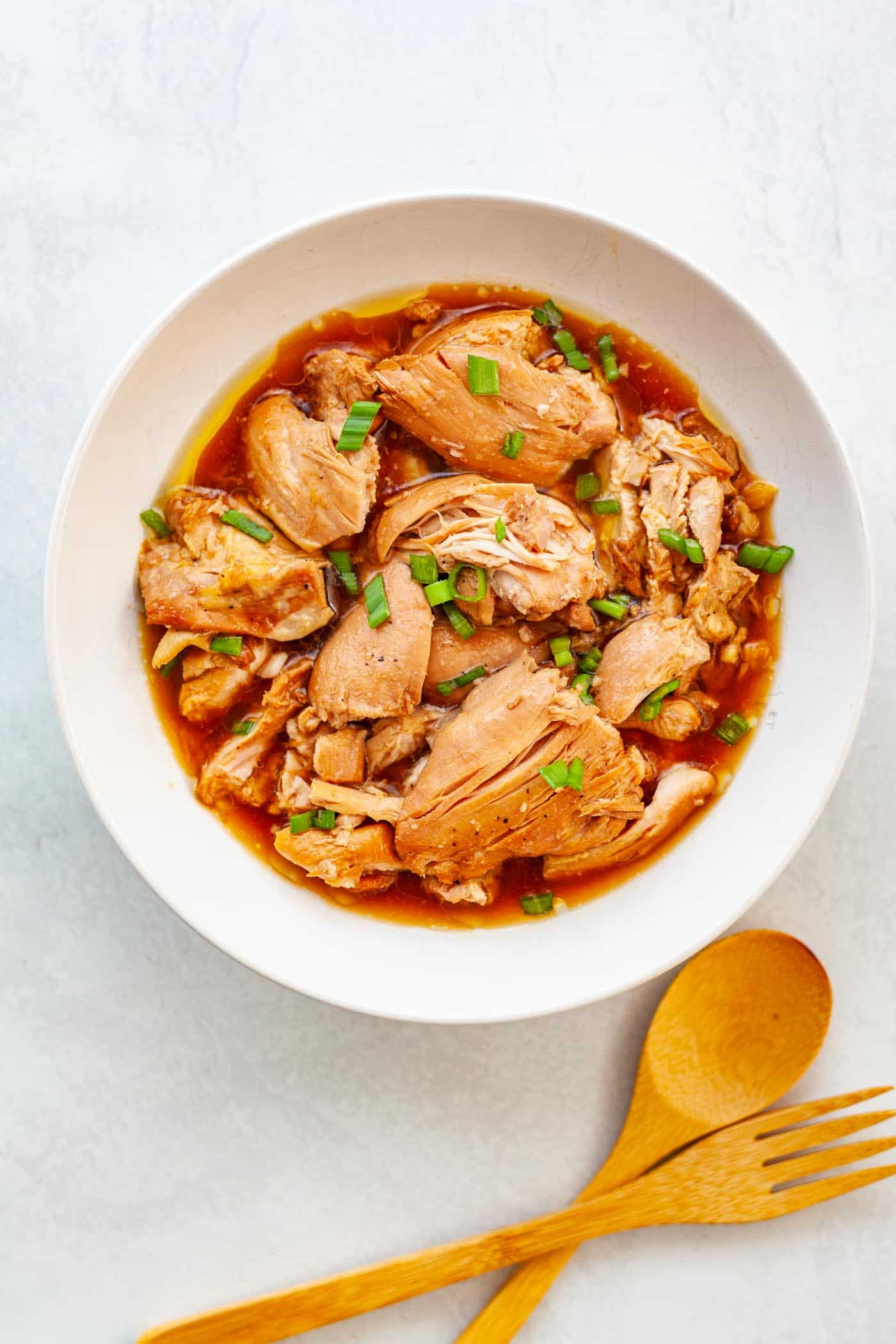 A bowl of Filipino chicken adobo made with boneless, skinless chicken thighs