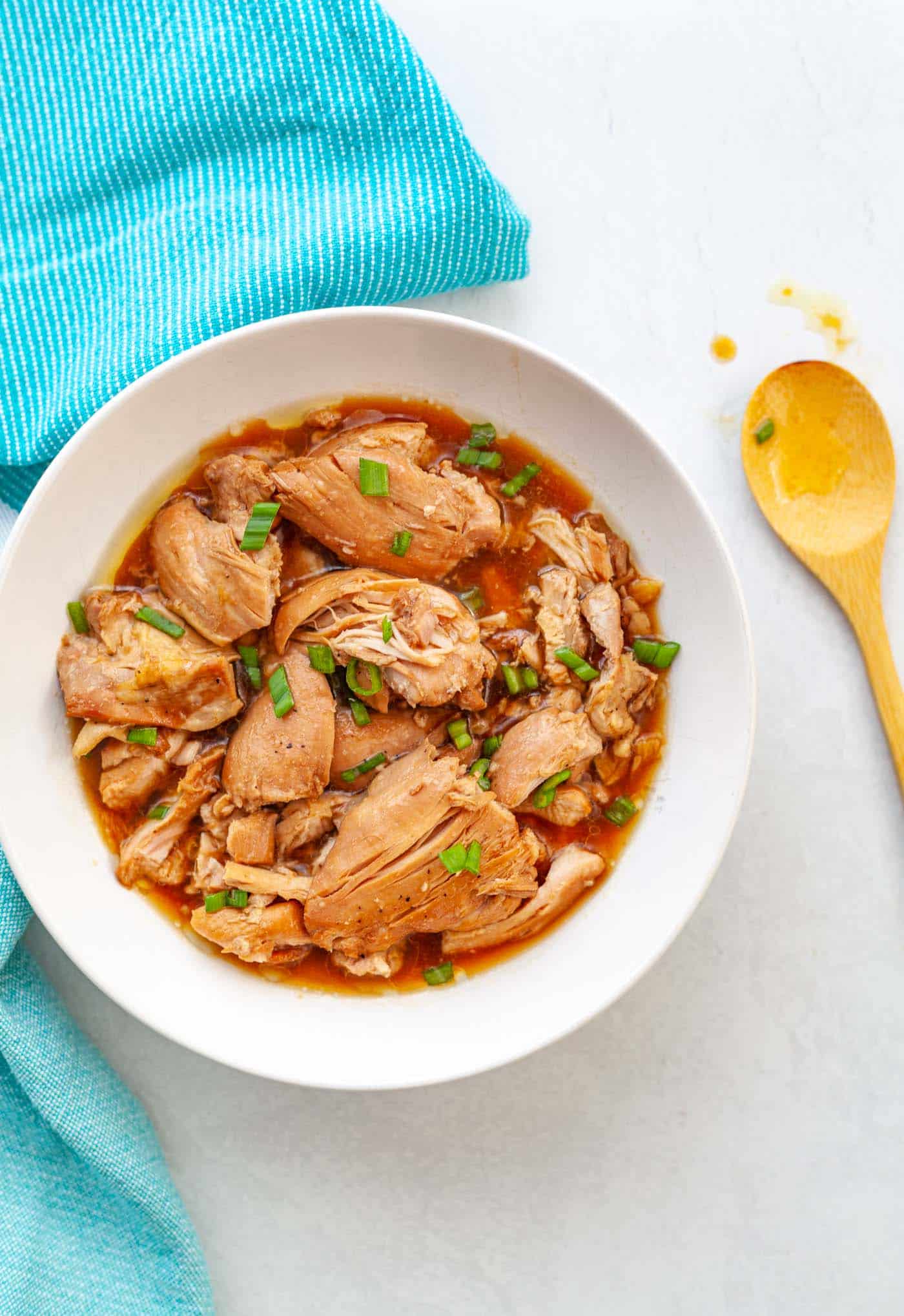 A bowl of Filipino chicken adobo made with boneless, skinless chicken thighs