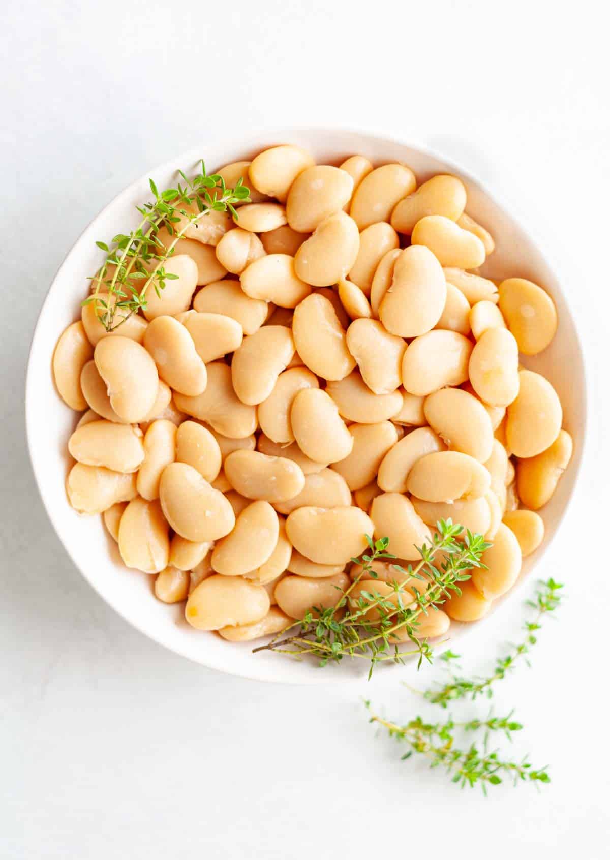 white bowl of canned butter beans