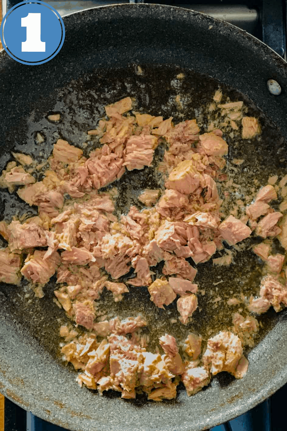 saucepan with canned tuna and olive oil