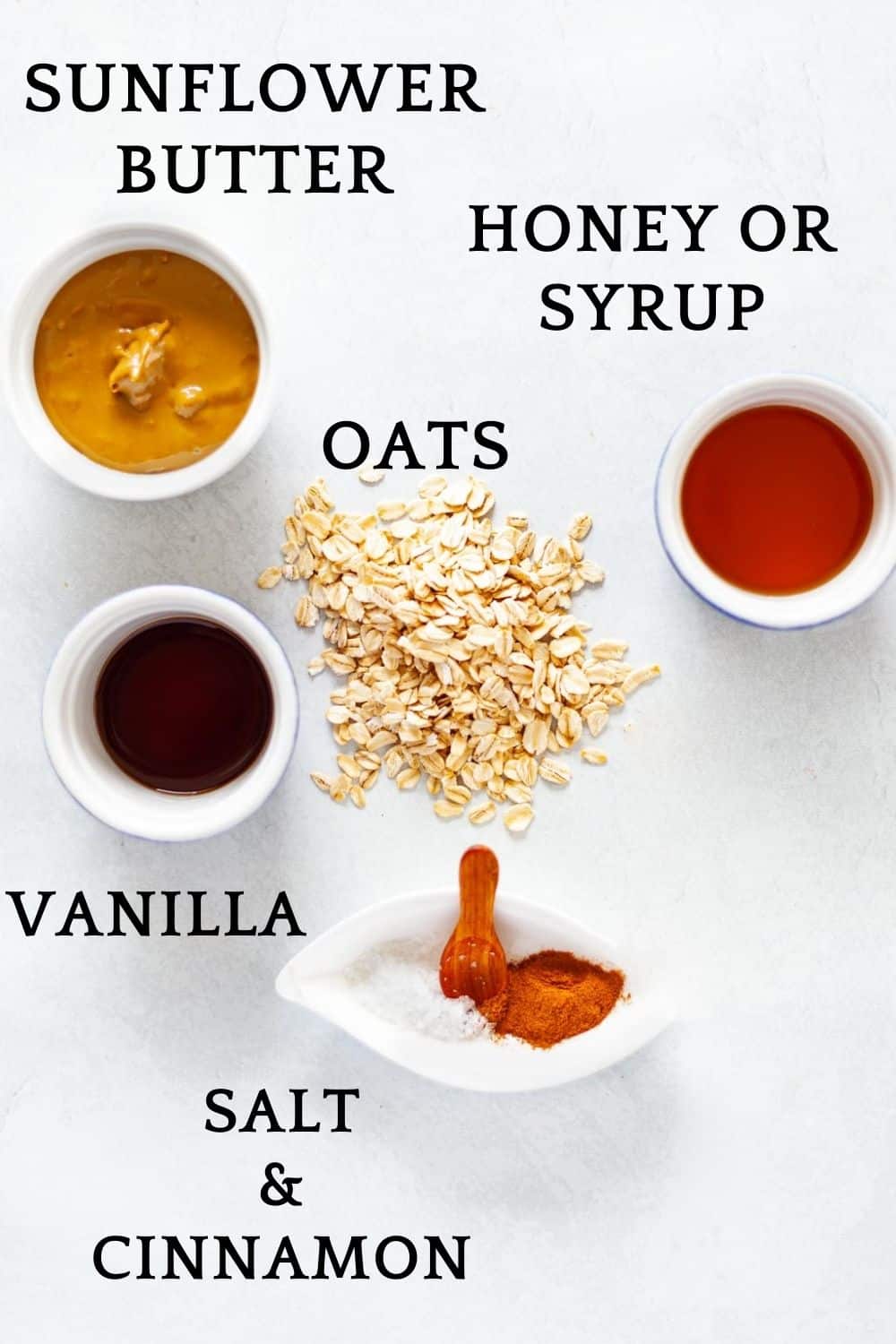 labeled ingredients for granola bars: sunflower butter, oats, honey or syrup, vanilla, salt and cinnamon