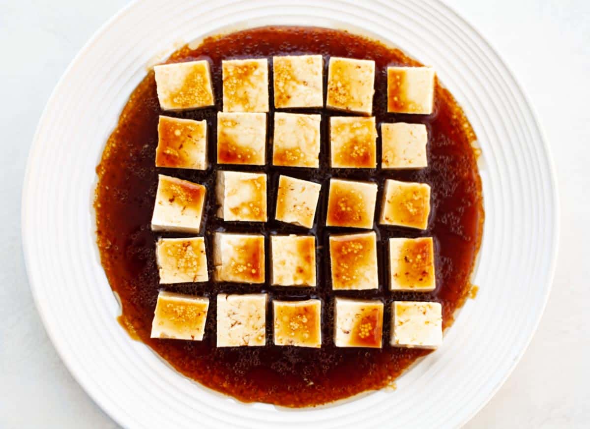 tofu marinating in soy sauce, balsamic vinegar, maple syrup and oil