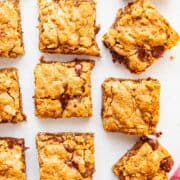 squares of oatmeal bars on a gray background