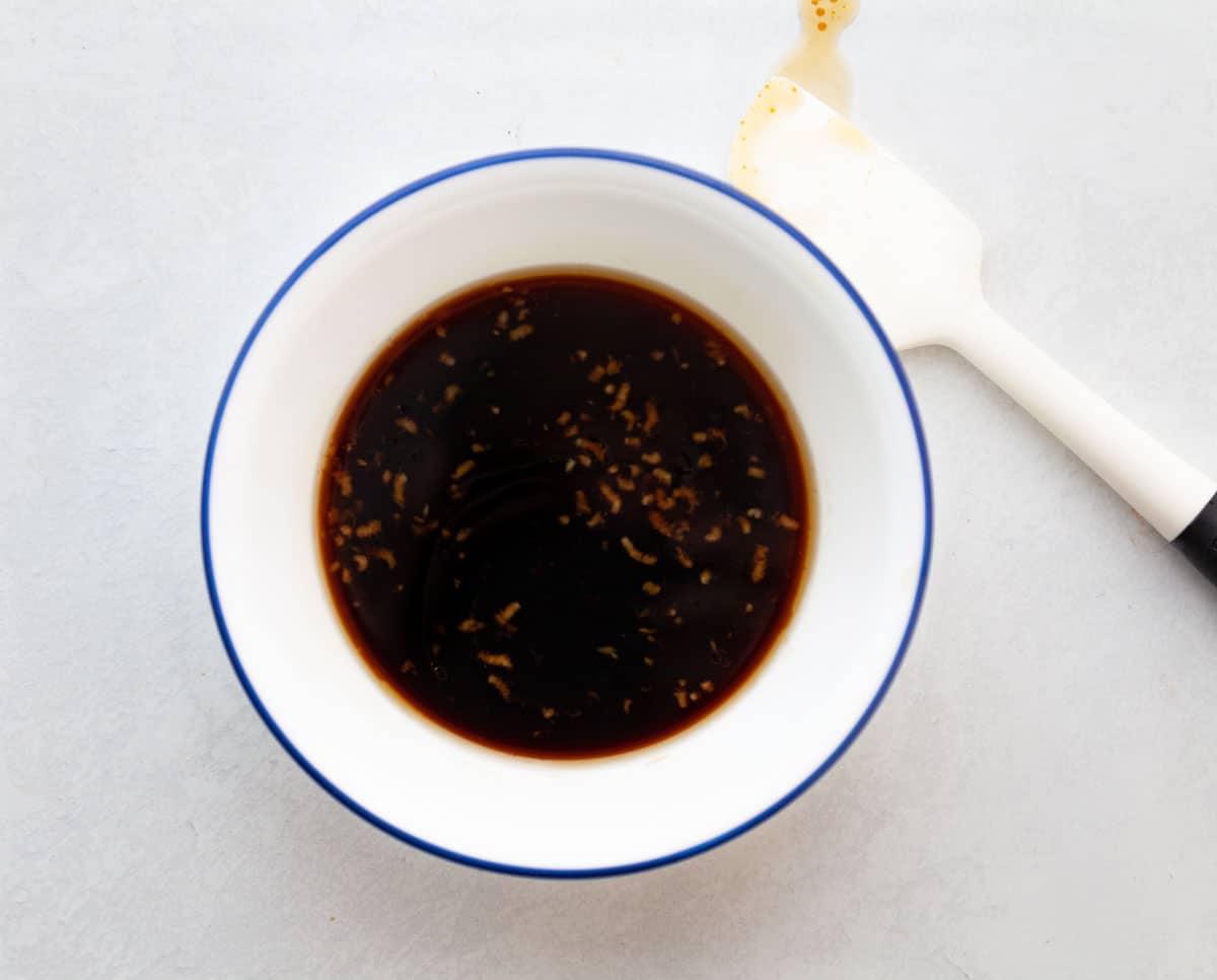 bowl of stir-fry sauce made from soy sauce, maple syrup, garlic, balsamic vinegar and sesame oil