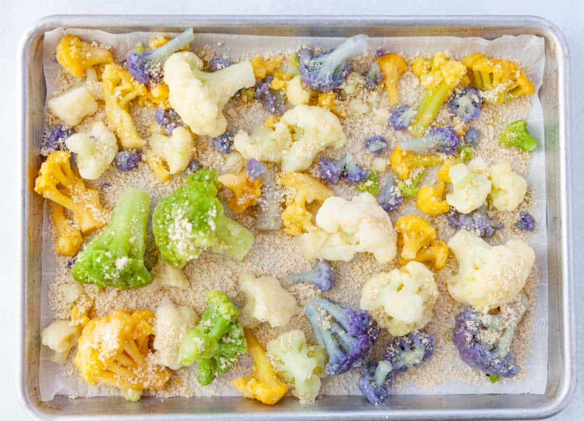 frozen rainbow cauliflower with olive oil and panko on a sheet-pan
