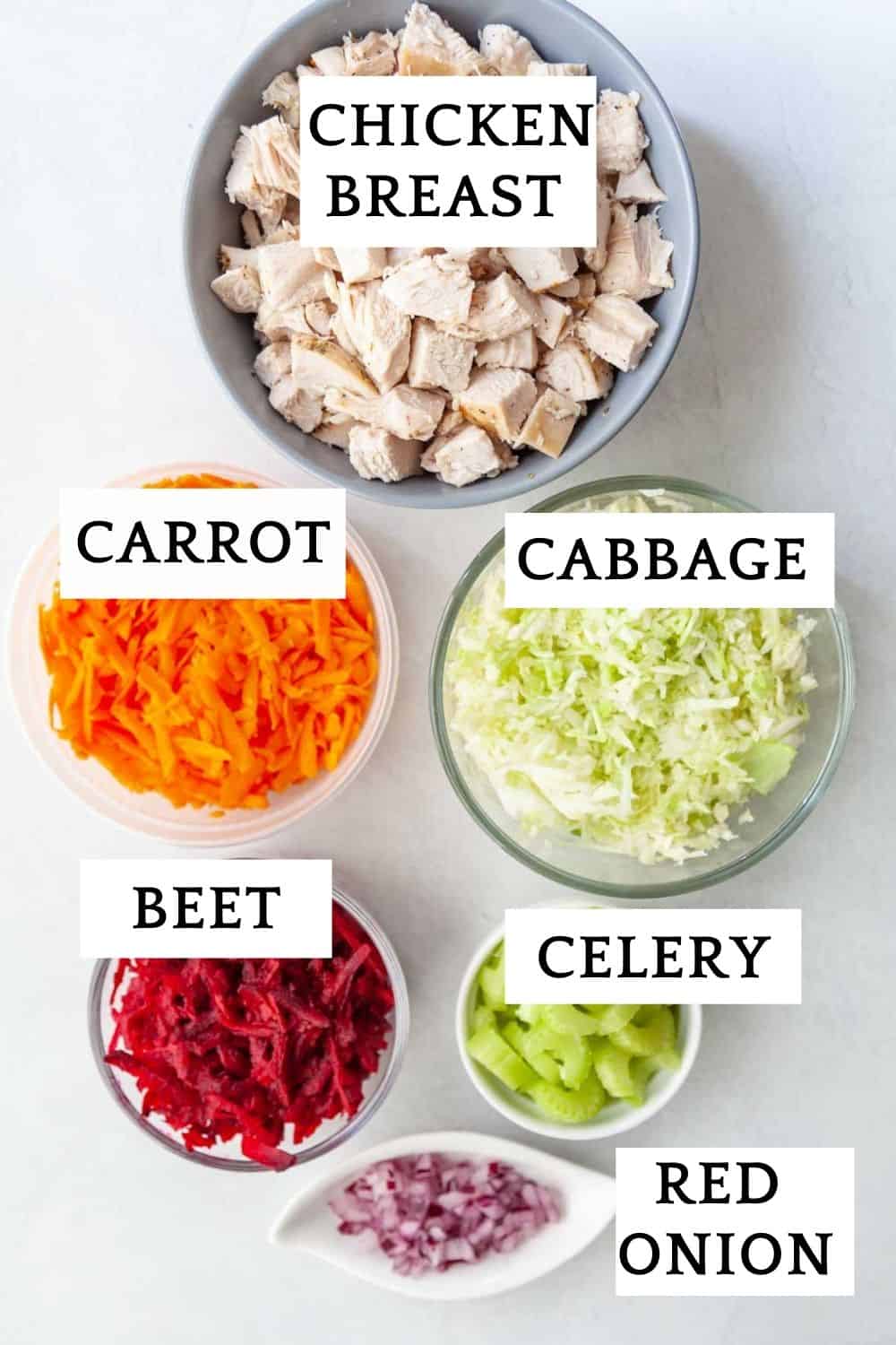 ingredients for veggie chicken salad: chopped chicken breast, cabbage, carrots, beet, red onion