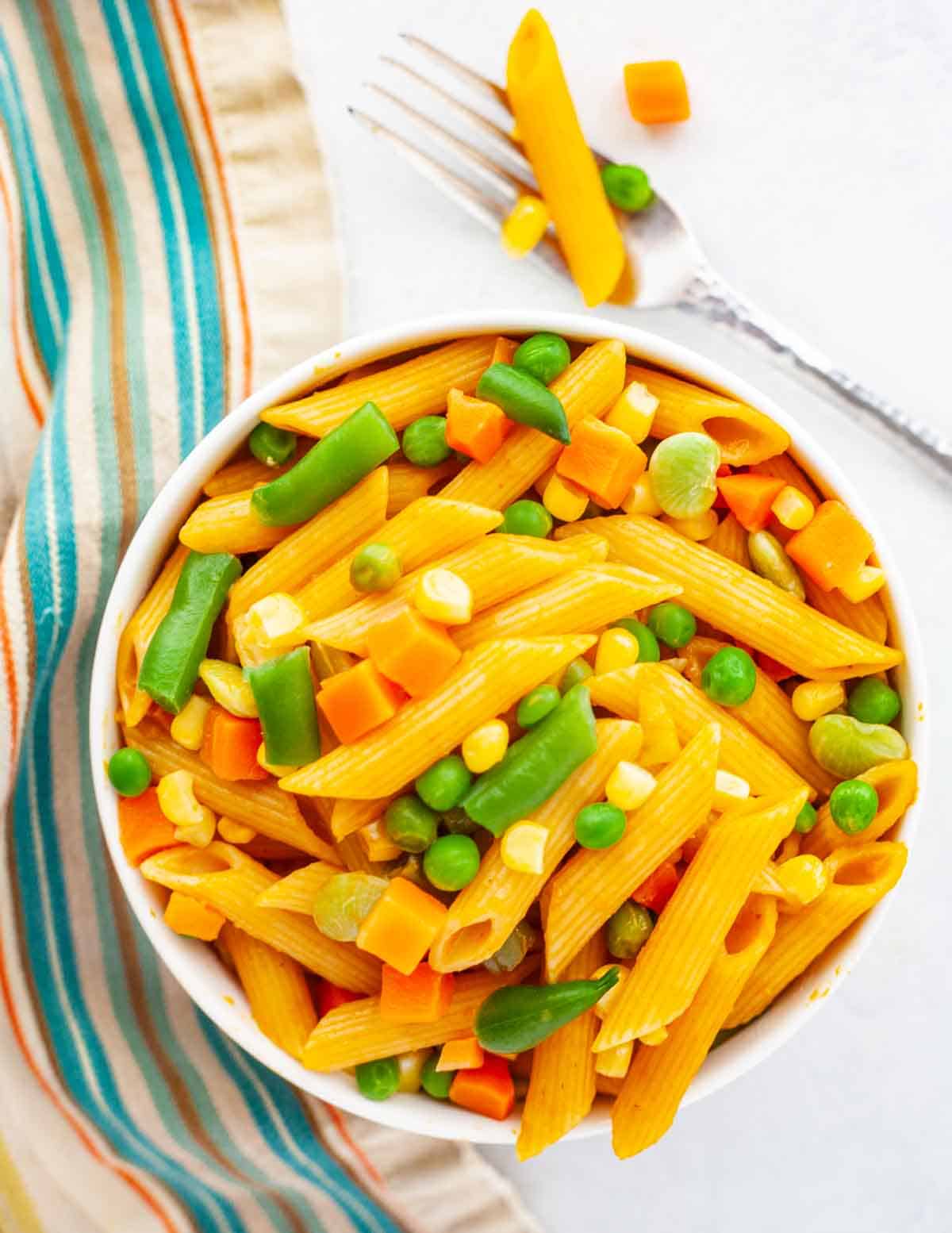 bowl of penne pasta with mixed frozen vegetables