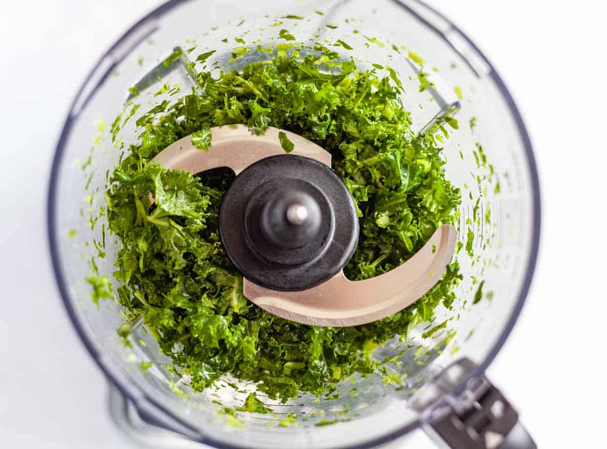 kale leaves chopped up in a blender