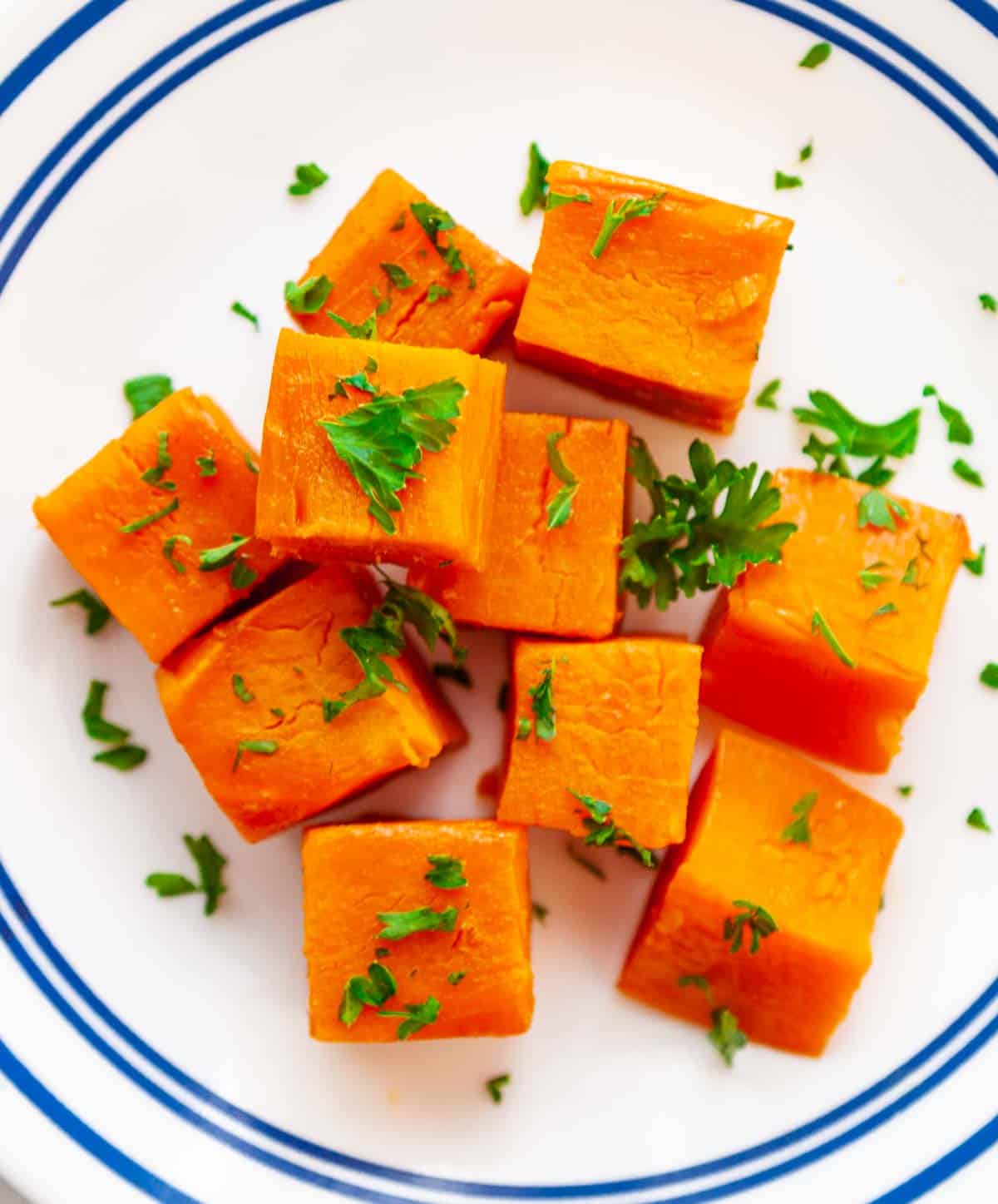 close-up of cubed, steamed sweet potato on a plate