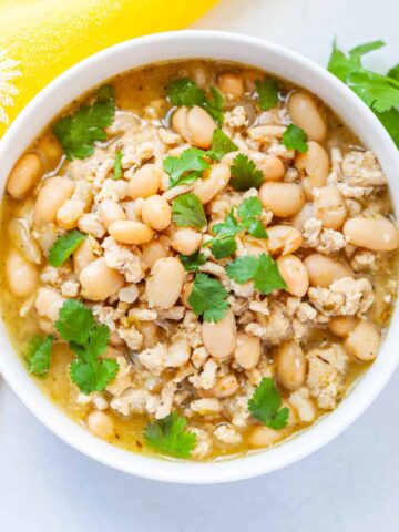 a bowl of Instant Pot ground turkey and white bean chili with tomatillo salsa