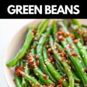 a bowl of steamed green beans in garlic and sesame sauce