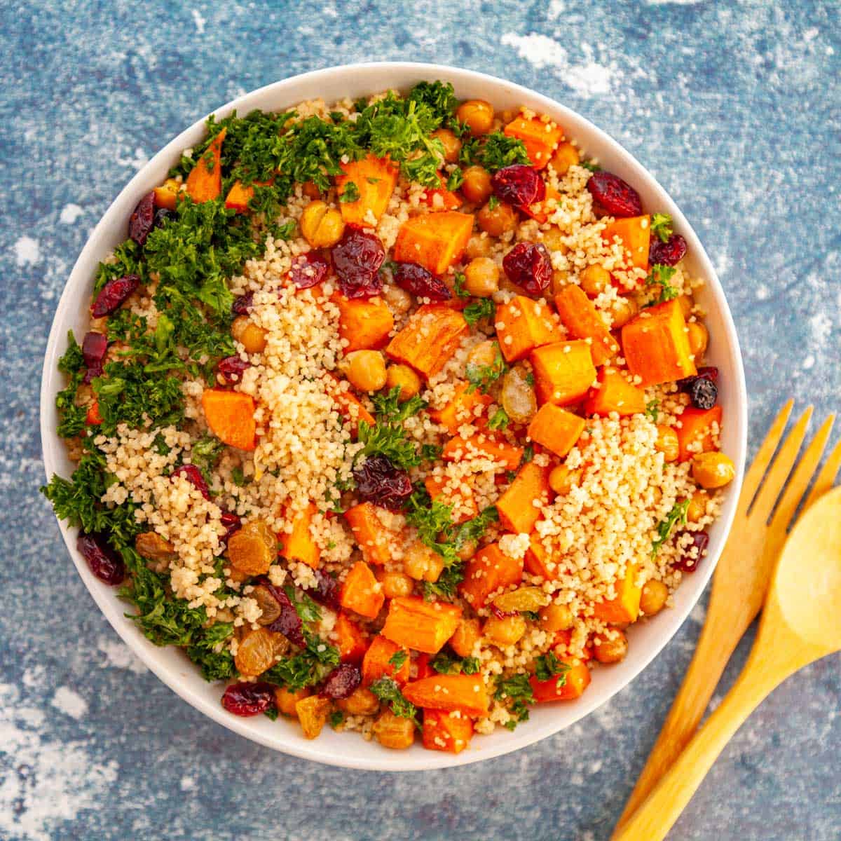 bowl of couscous with sweet potatoes and parsley
