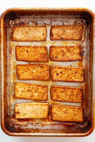 broiled slices of tofu in a baking pan