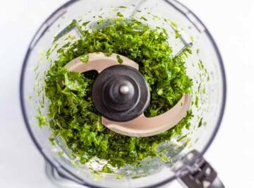 finely chopped and shredded curly kale leaves in a food processor bowl