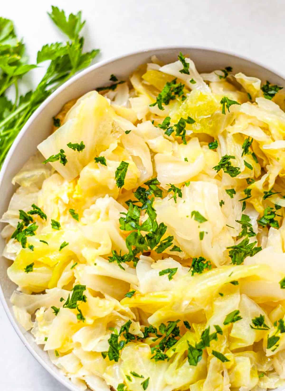 close-up of cooked cabbage topped with parsley