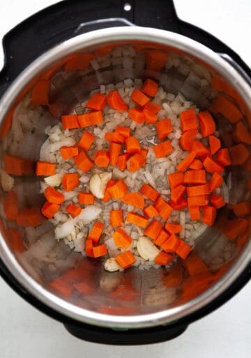 onion and carrot in a pressure cooker