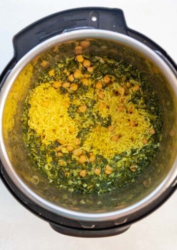 cooked coconut turmeric rice with greens in an Instant Pot