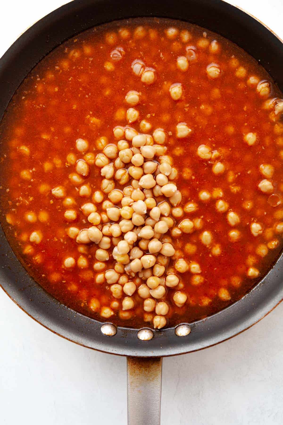 garbanzo beans in tomato sauce in a skillet