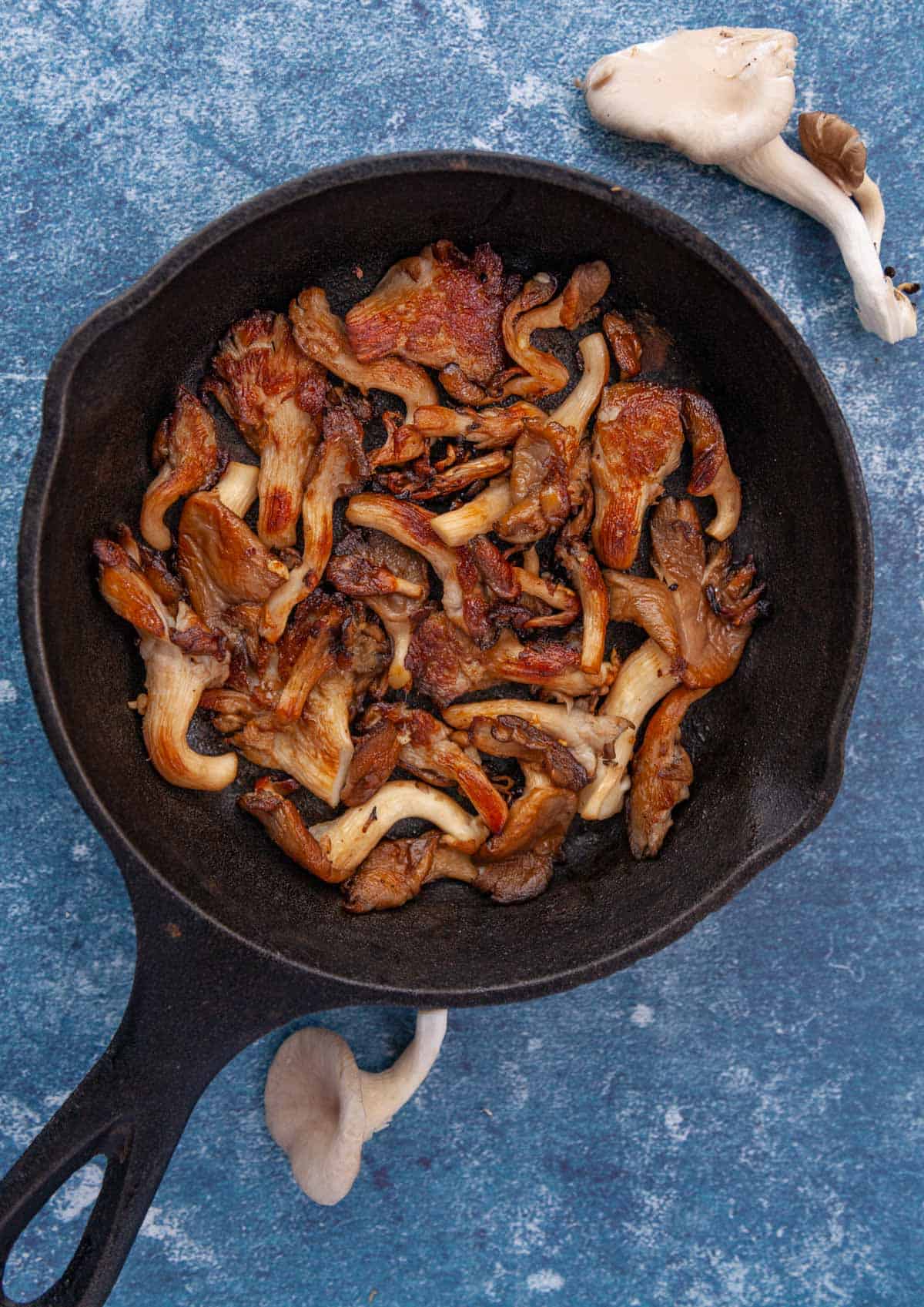 a small cast iron skillet of sauteed mushrooms