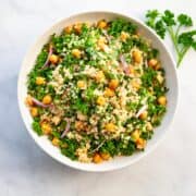 a bowl of quinoa salad with kale
