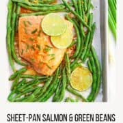 sheet-pan with cooked salmon and green beans garnished with lime wedges