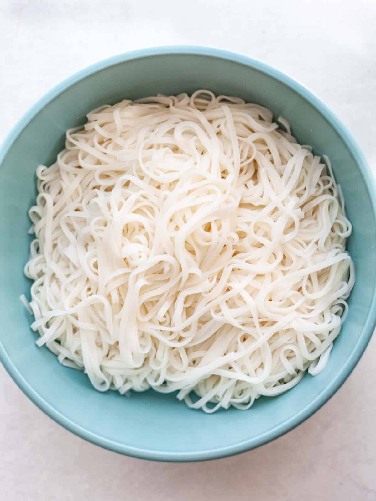 a bowl of cooked rice noodles