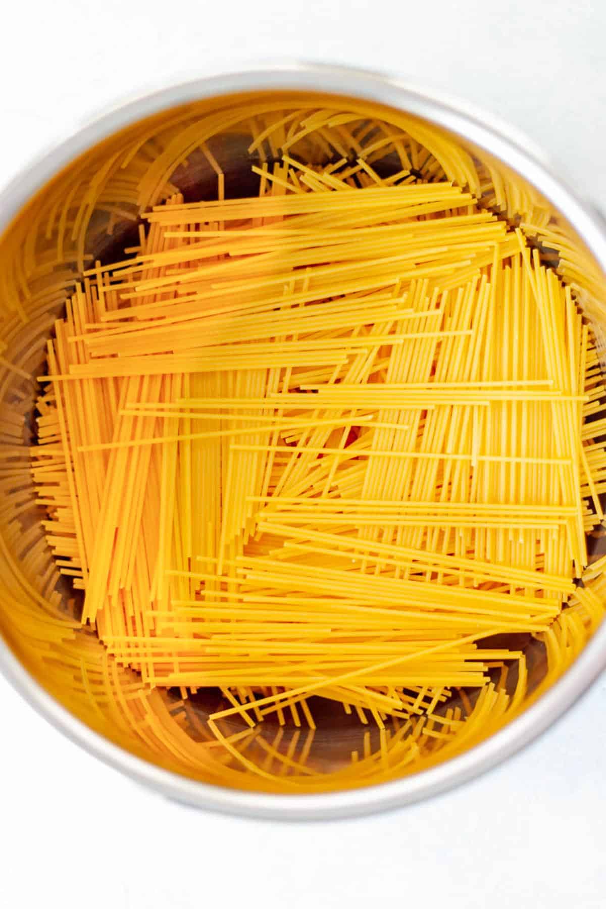 uncooked broken spaghetti noodles in an Instant Pot