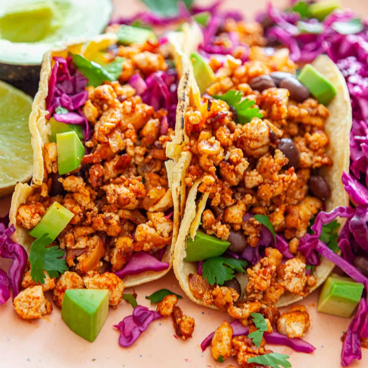 corn tortillas stuffed with crumbled tofu, black beans and avocado.