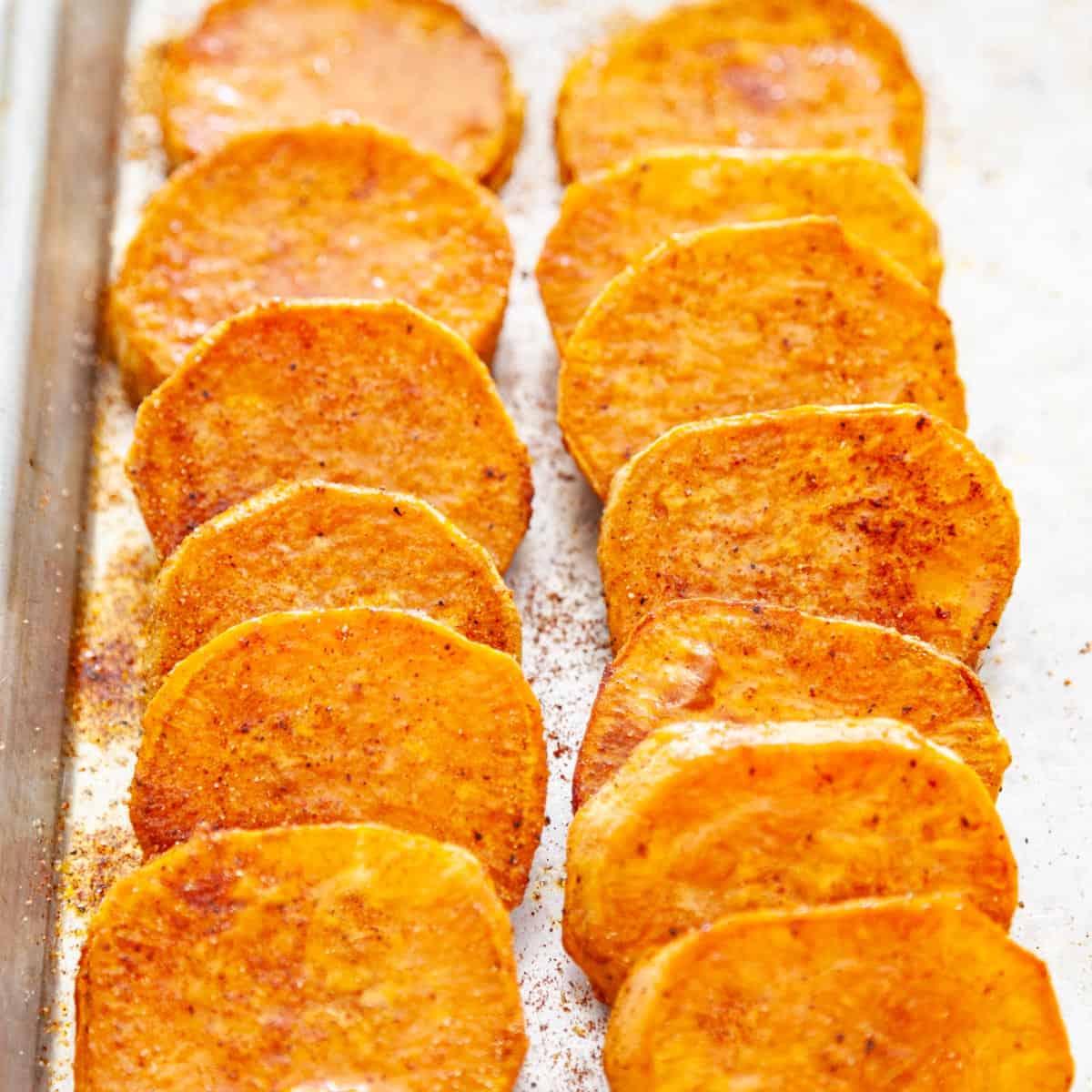a sheet-pan of baked sweet potato slices 