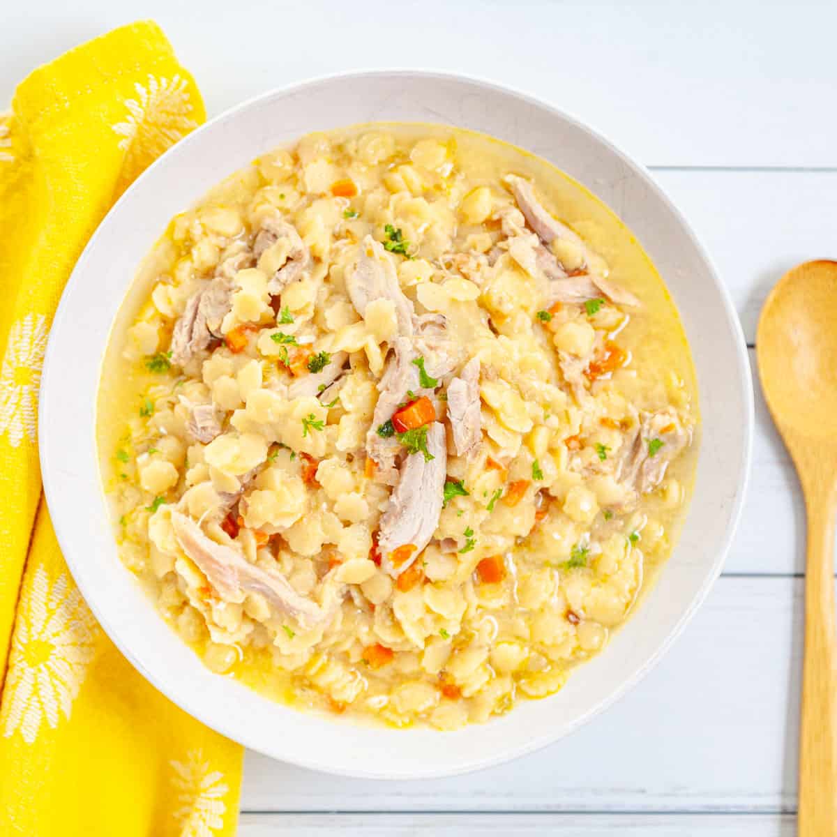 A bowl of tiny star pasta and chicken.