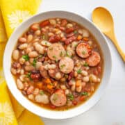 Bean soup with slices of sausage.