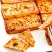 Slabs of cooked tofu.