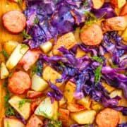 Roasted potatoes, purple cabbage and sliced sausage topped with dill.
