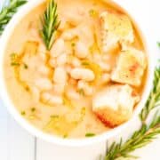 A bowl of white bean soup.